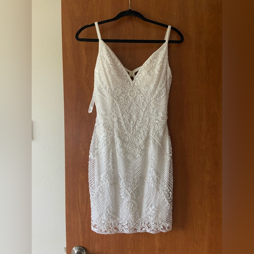 White and full beaded design all over and Brand new.